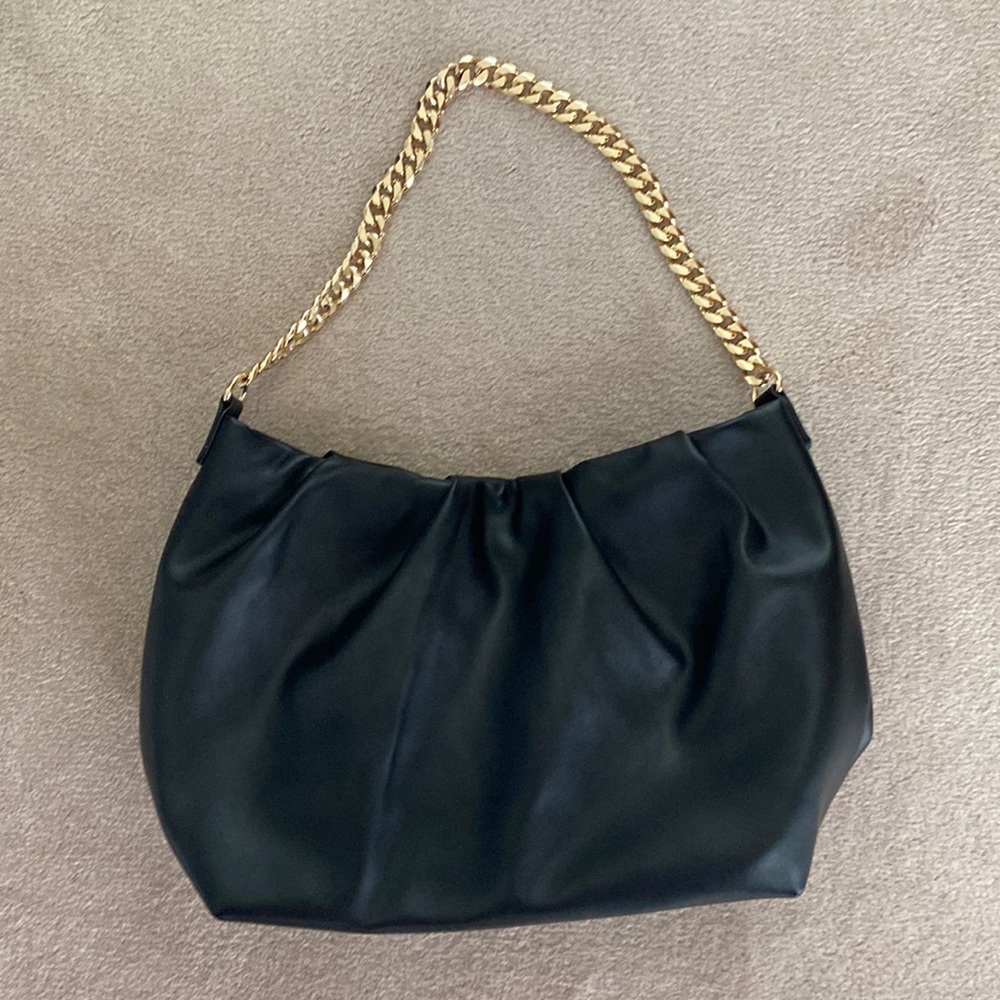 Black purse with gold chain strap